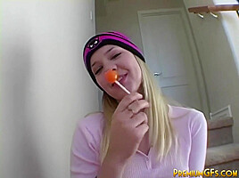 Hot blonde licking candy tease with big tits closeup